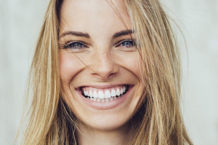 Young woman with a straight white smile