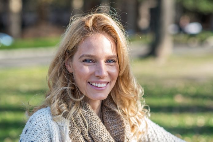 Adult woman with straight teeth