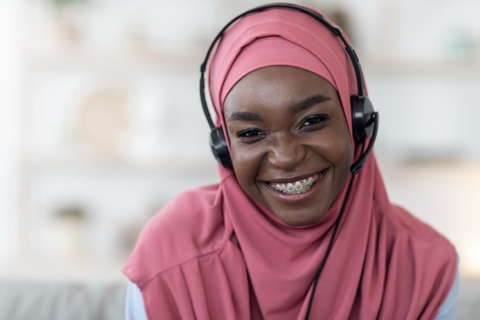 Young woman working and smiling with braces