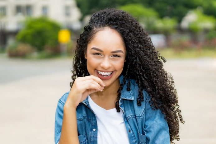 Teenage girl with pretty teeth smiling