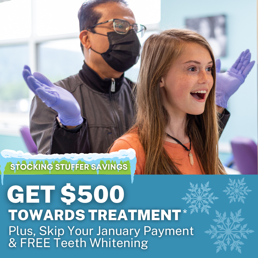 Dr. Ghosh smiling with patient after braces off, Stocking Stuffer Savings Get $500 towards treatment plus skip your january payment and get a free teeth whitening