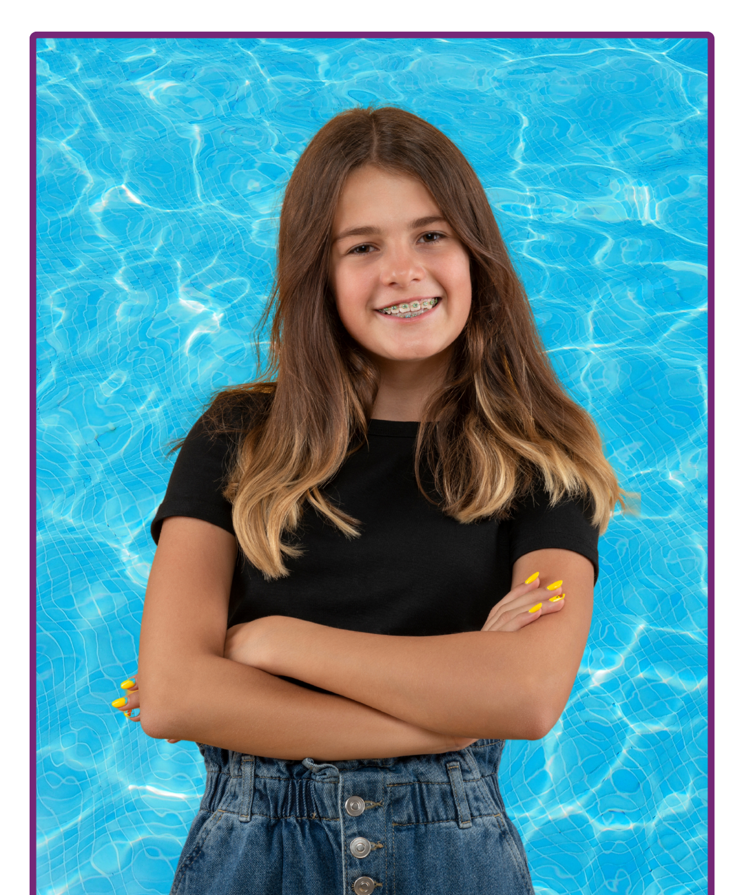 Smiling teen with braces in front of blue pool background